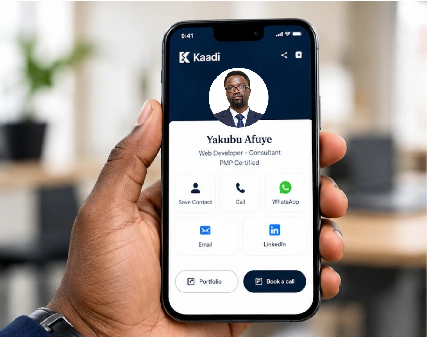 A hand holding a phone showing a Kaadi card